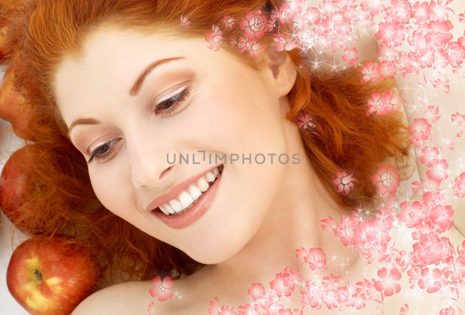 picture of lovely redhead with red apples and flowers