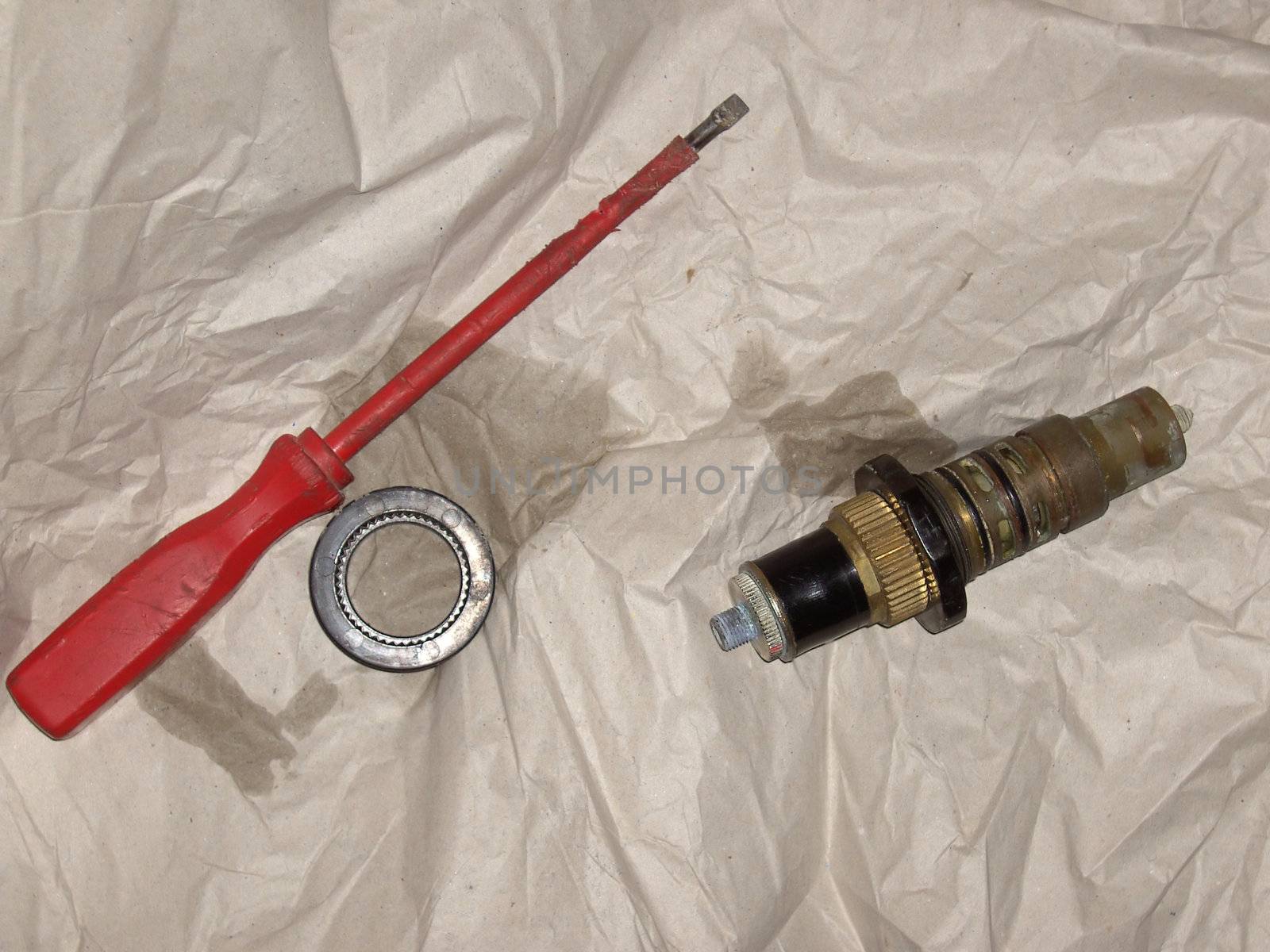 defect water valve with screwdriver 