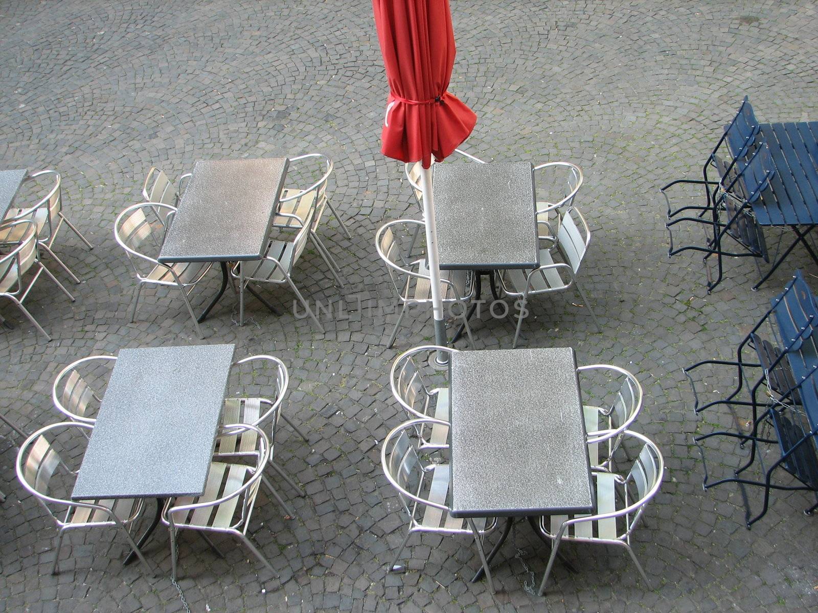 empty roadside restaurant tables and chairs