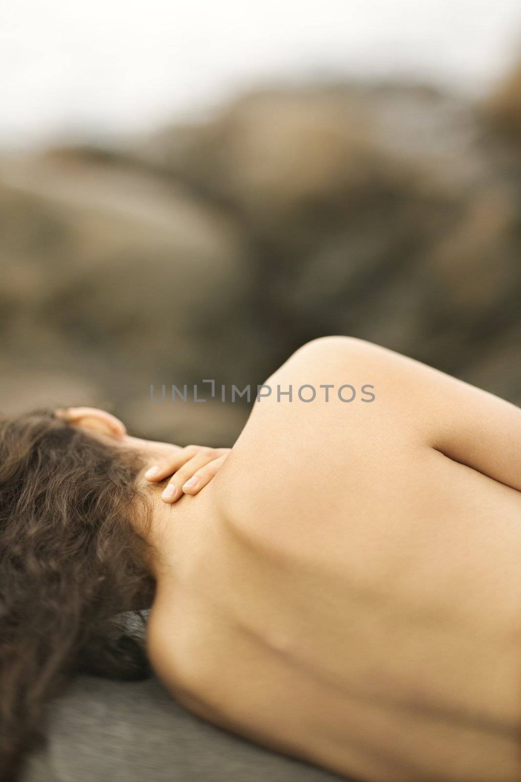 Nude woman on rock. by iofoto