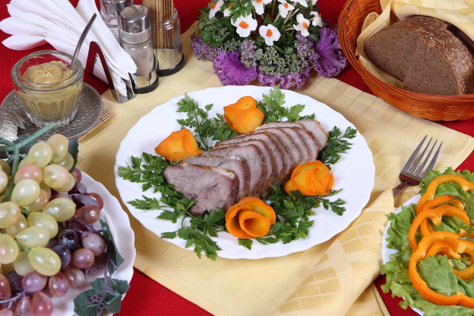 Nourishing dinner with pork, vegetables and fruits