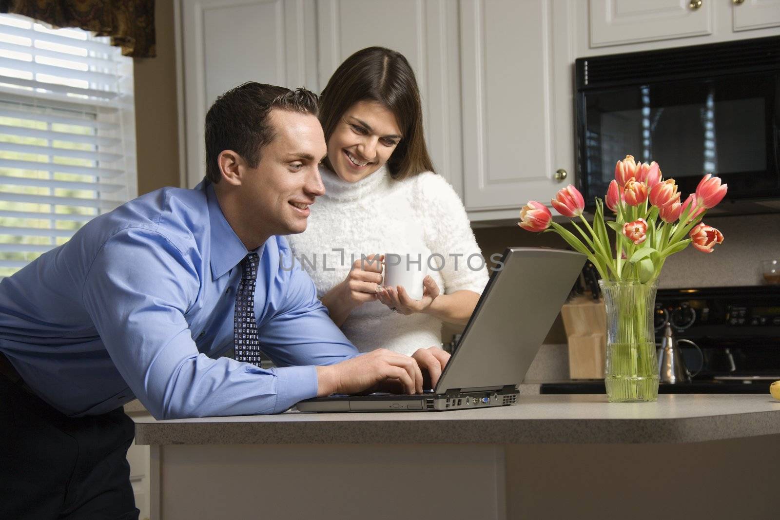 Couple with laptop. by iofoto