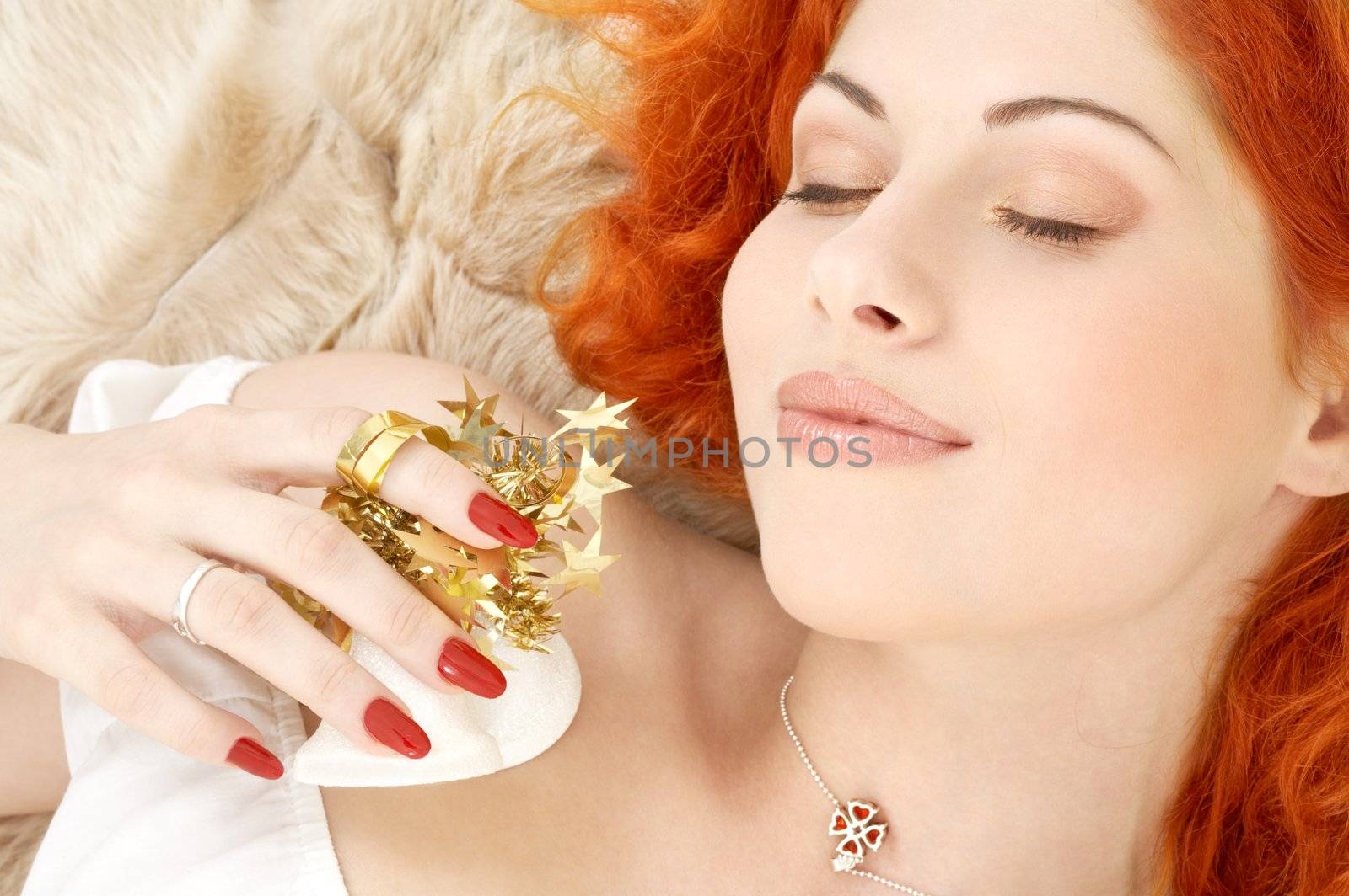 dreaming redhead girl with white christmas bells