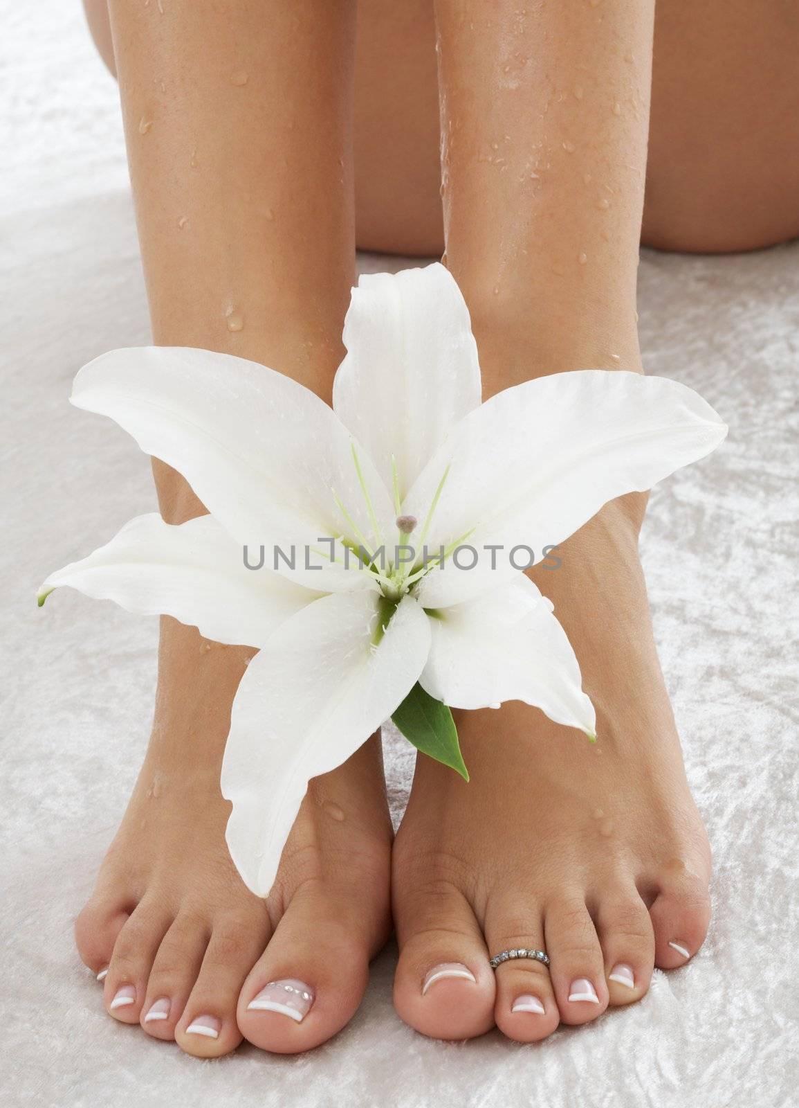 feet with white lily by dolgachov