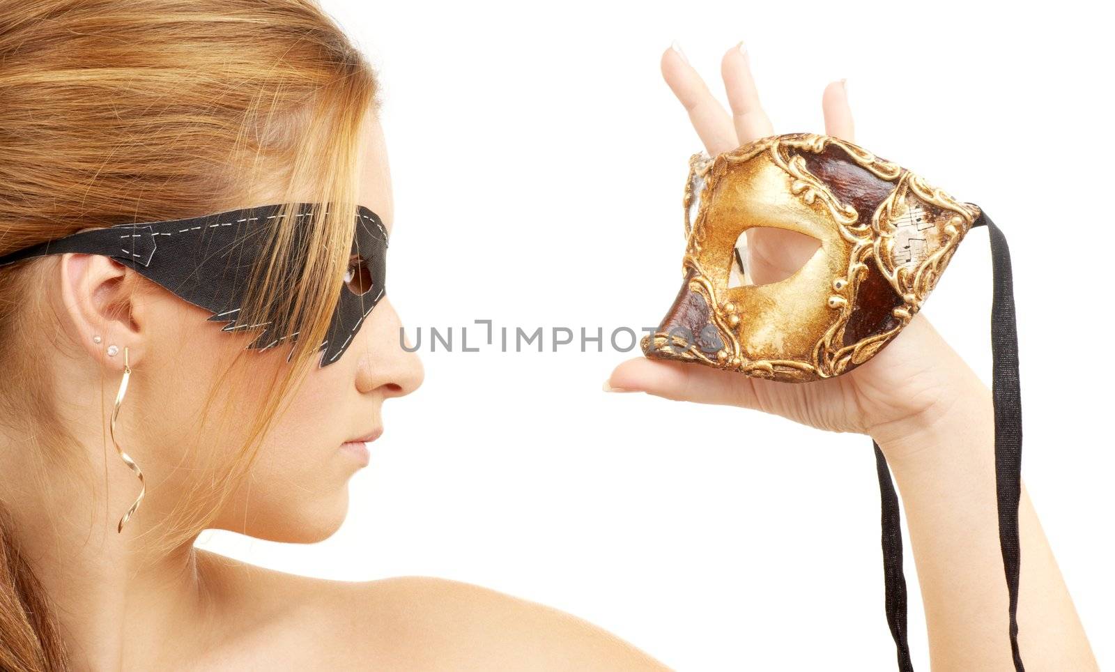 portrait of beautiful young woman holding venetian carnival mask