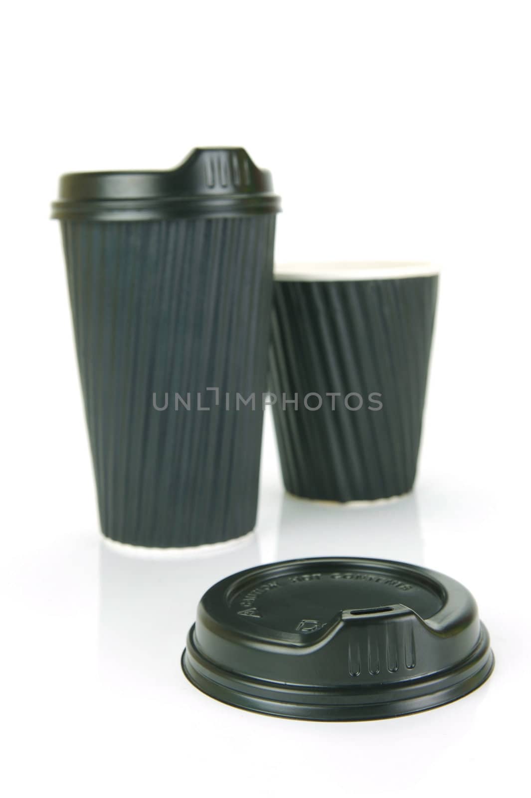 Takeaway coffee cups isolated against an orange background