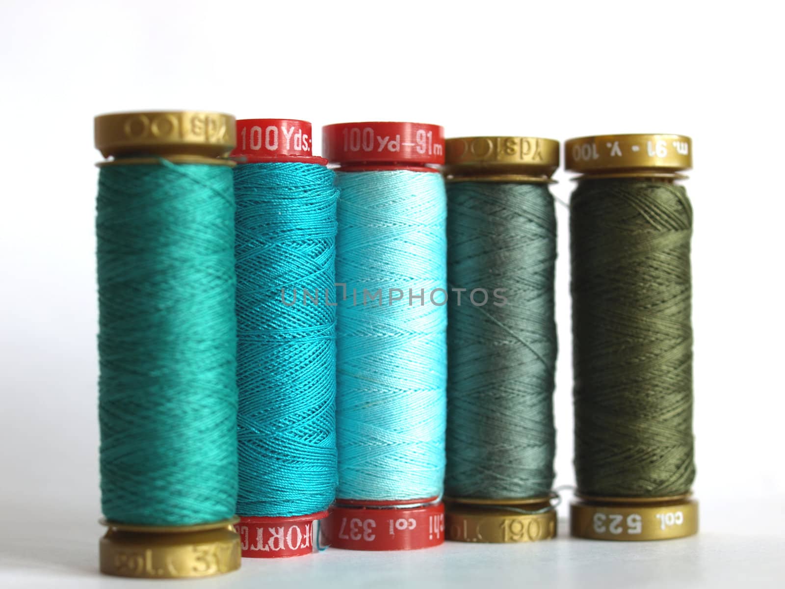 Green sewing threads spools