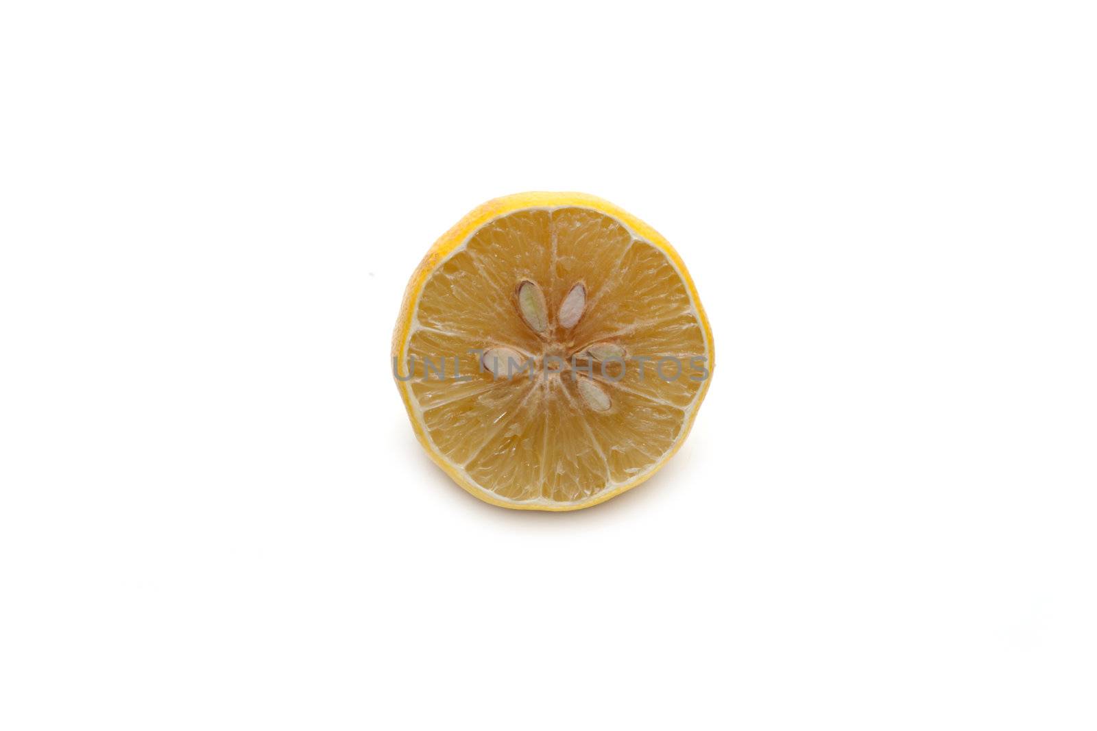Half of the lemon, cut dry on white background