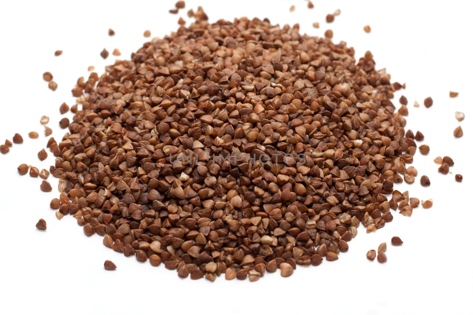 Heap buckwheat croups, disposit on white background