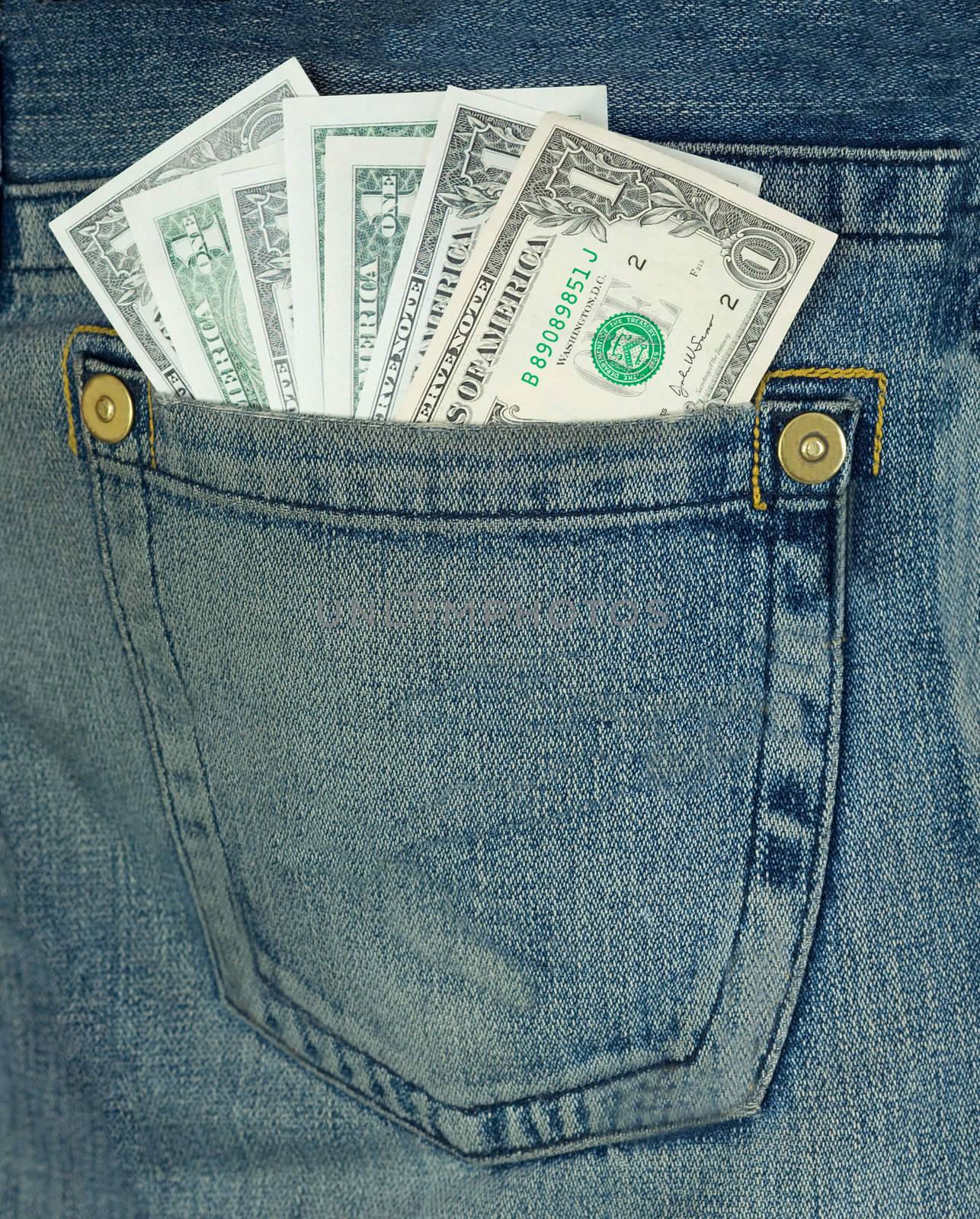Batch dollars in hip-pocket on blue jeans