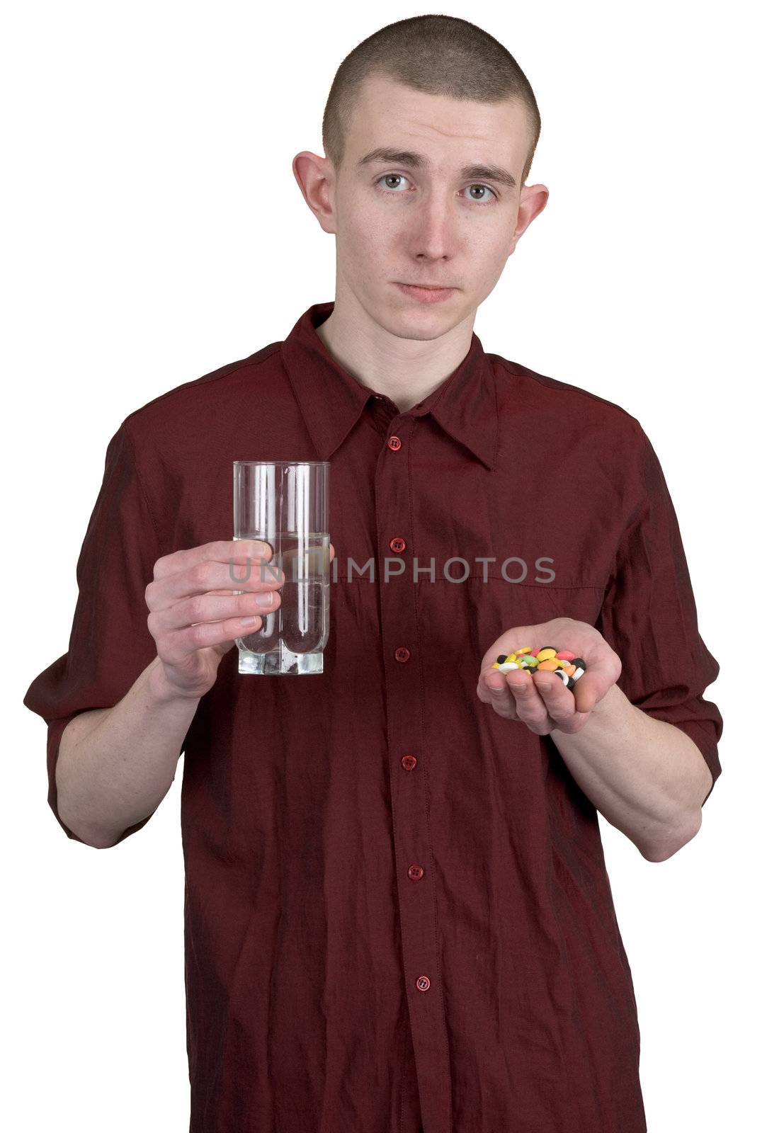 Guy with glass of water and tablets on hands