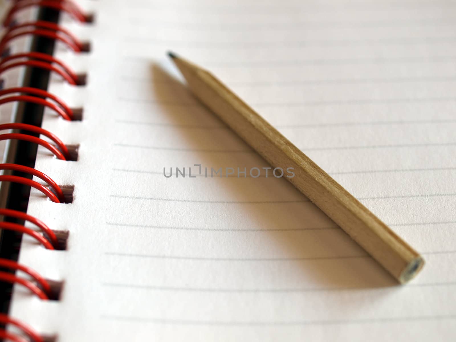 Notebook note pad page with pencil