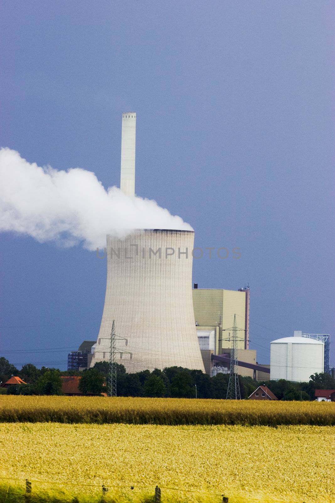 Power plant with one cooling tower against dark sky