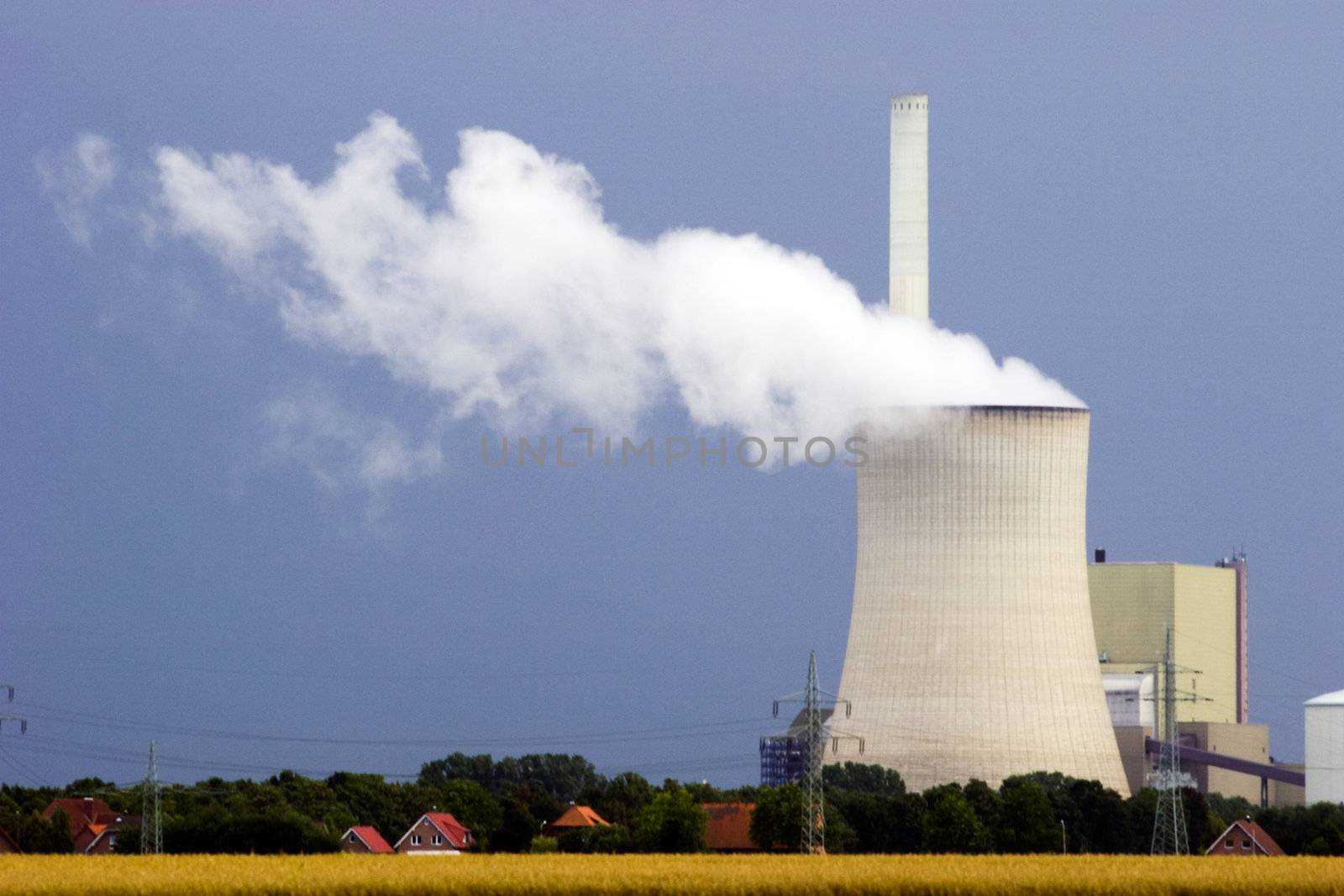 Power plant with one cooling tower against dark sky