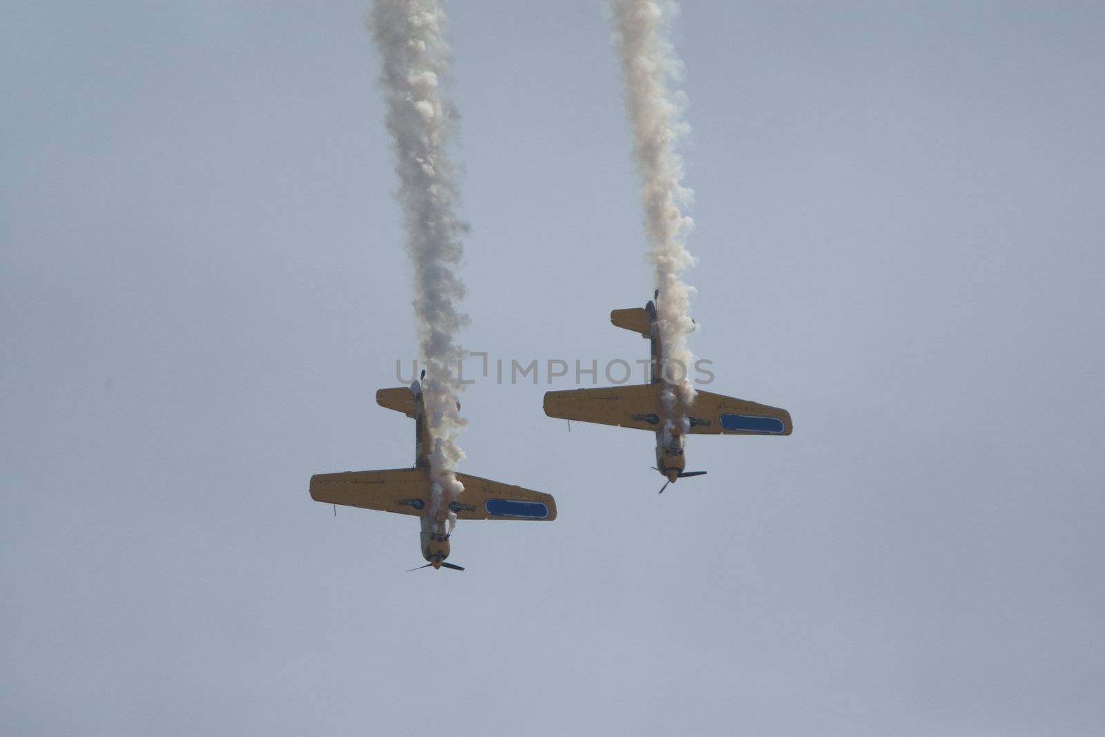 Acrobatic airplanes perform during the airshow on July 17, 2010 on Henri Coanda airport, Bucharest, Romania.