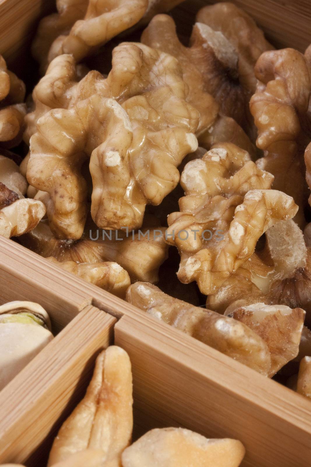 Nuts of different grades in a wooden box.