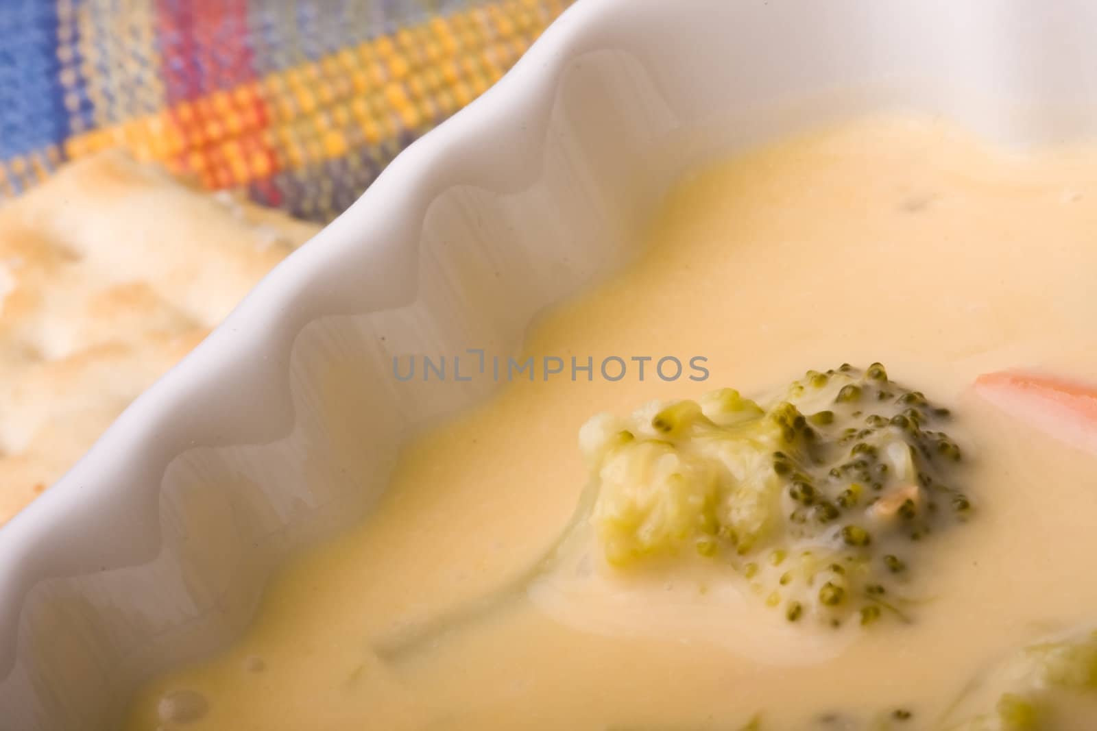 cream of broccoli soup on a blue placemet