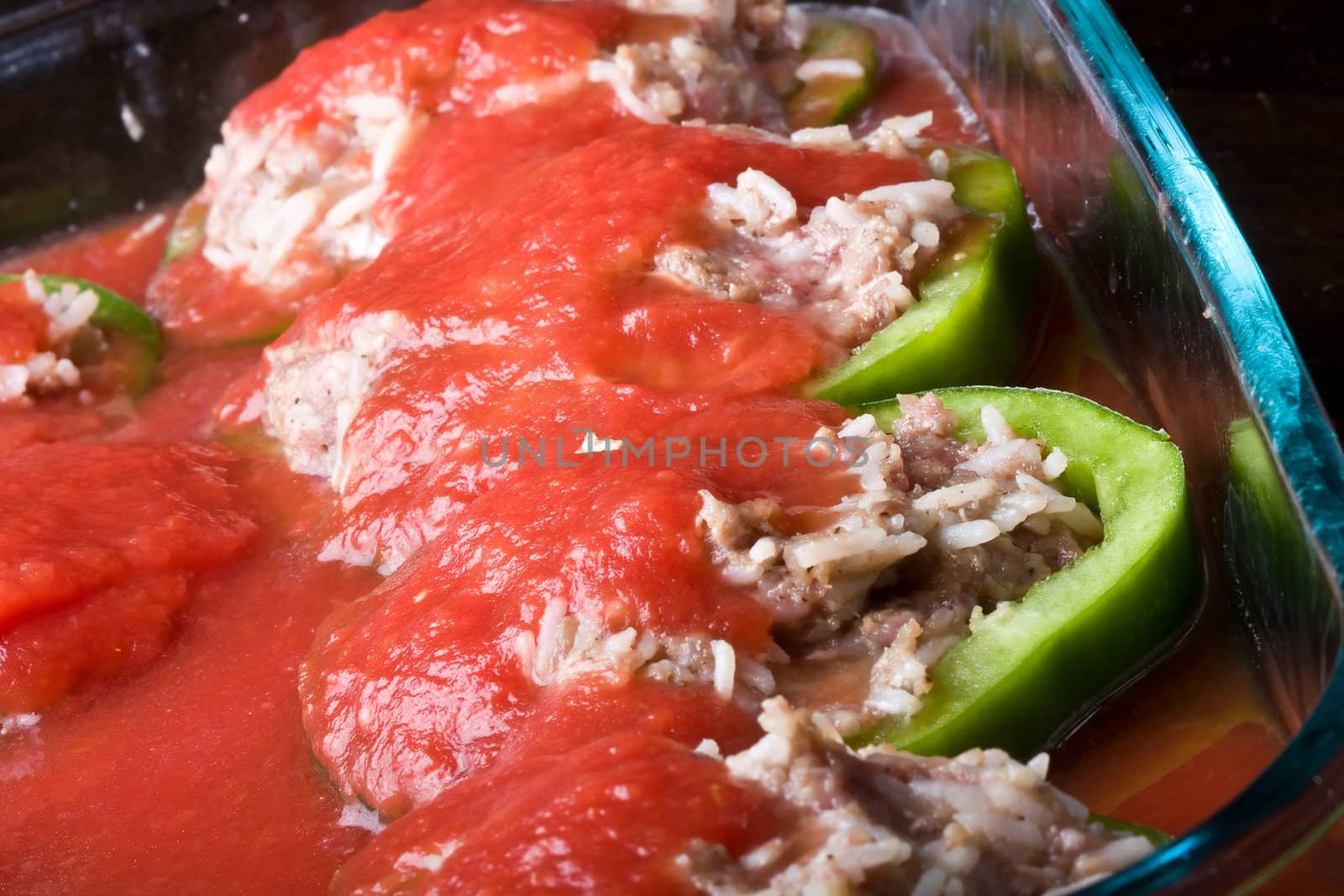 stuffed peppers cut in to slices with tomato sauce 