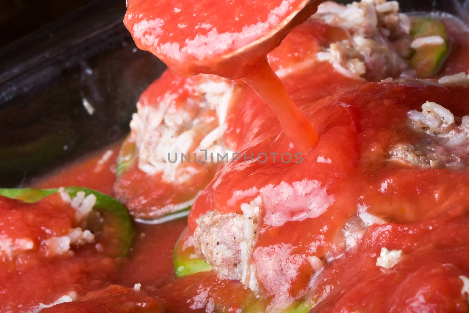 stuffed peppers cut in to slices with tomato sauce 