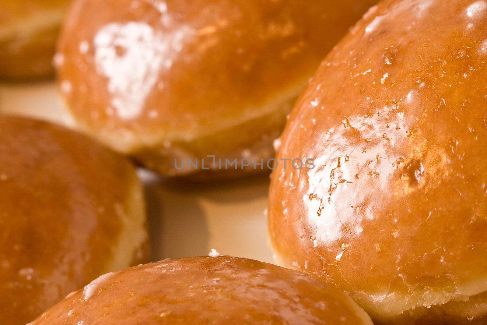 hot fresh iced doughnuts shot with a macro lens