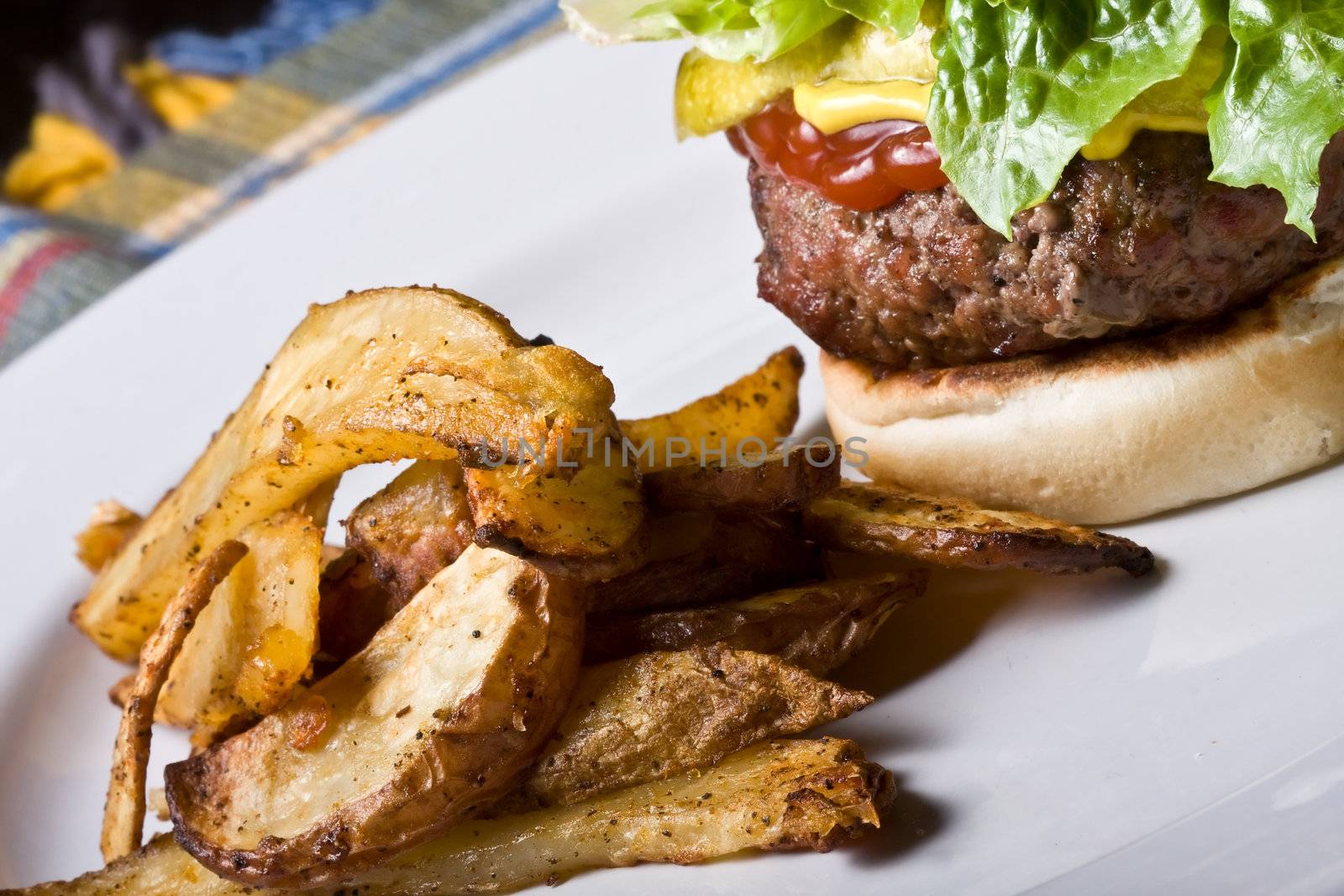 nice big juicy hamburger on a white plate