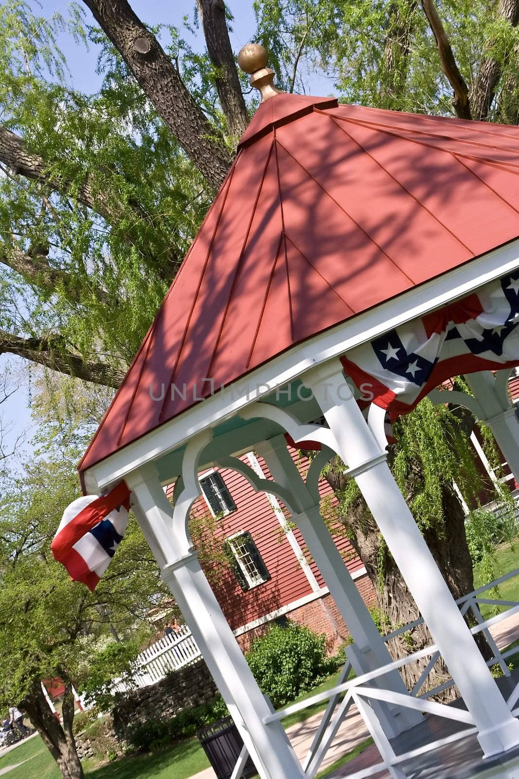 an american gazebo with flags hanging just in time for summer