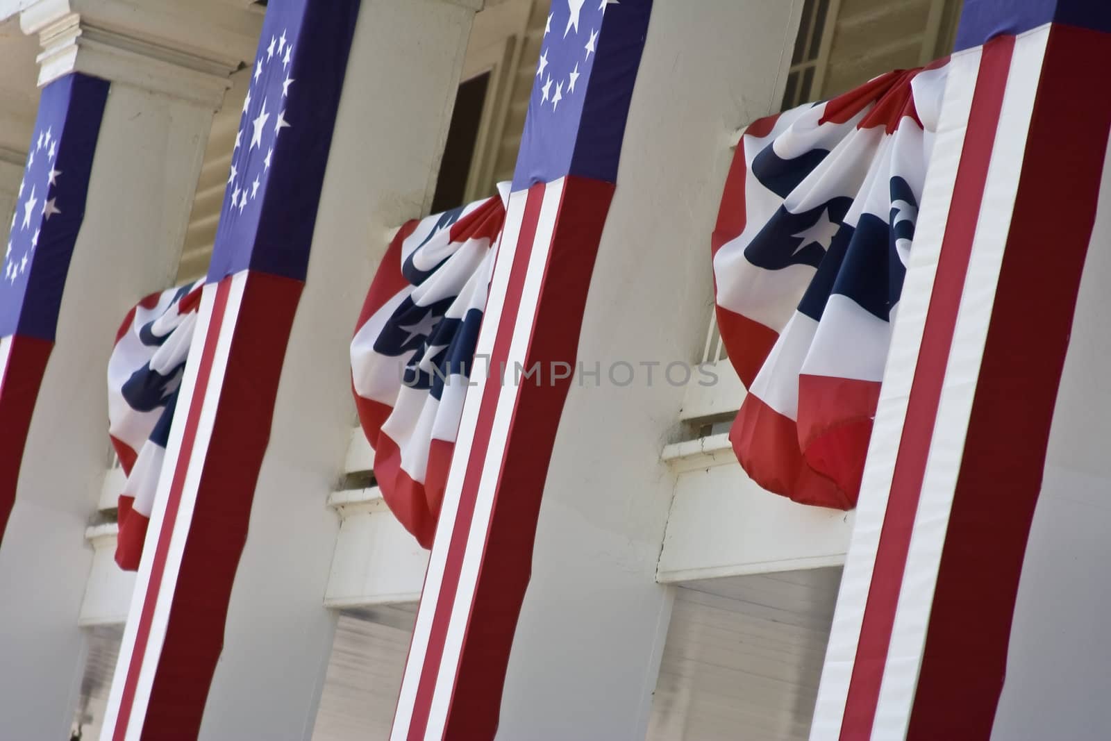 front of an old building with us flags and banners hanging from it