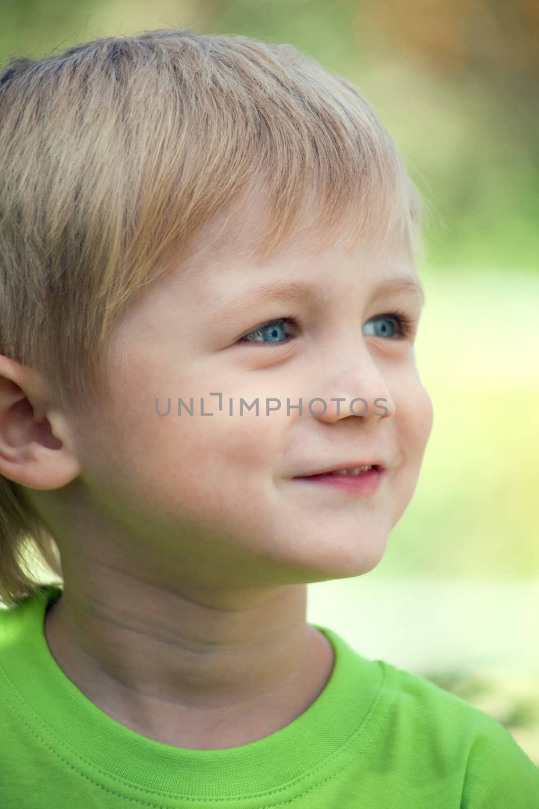 Portrait of a boy three years, head turned, looking away. Blonde, Caucasian .