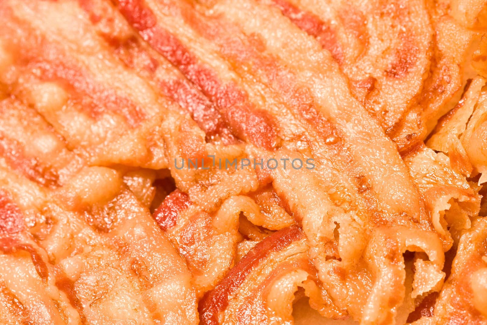 close up of cooked bacon fresh off the stove