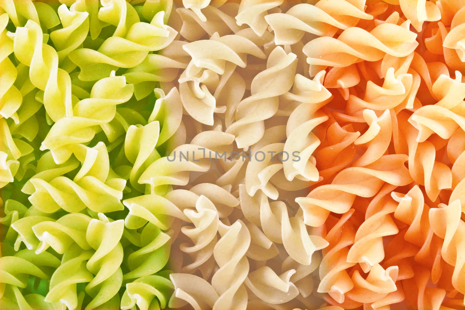 Fusilli is a long, thick, corkscrew shaped pasta.  Image tinted in colors of Italian flag.