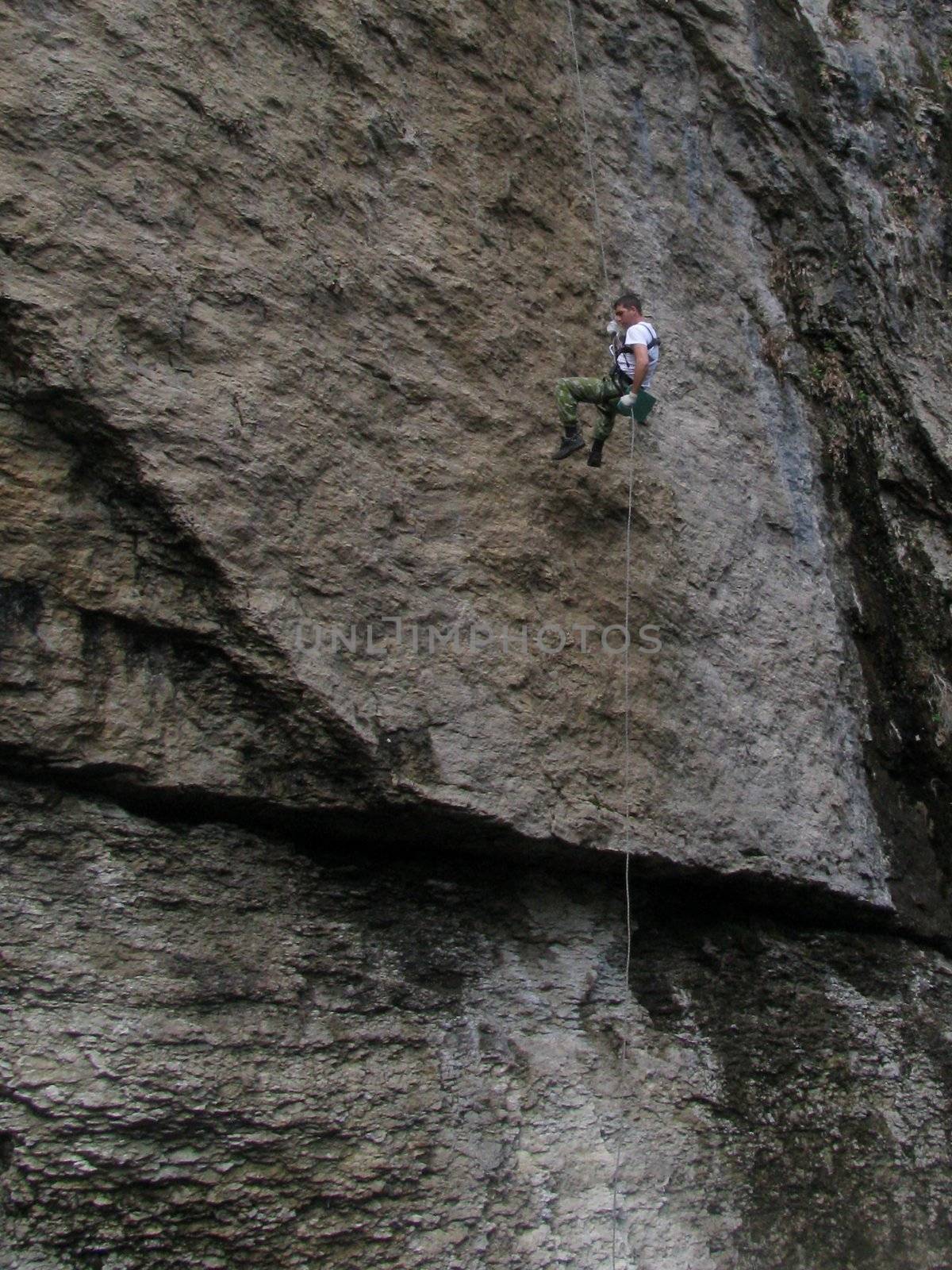 Rock-climbing; people; sports; mountaineering; an extreme; rest; tourism; entertainment