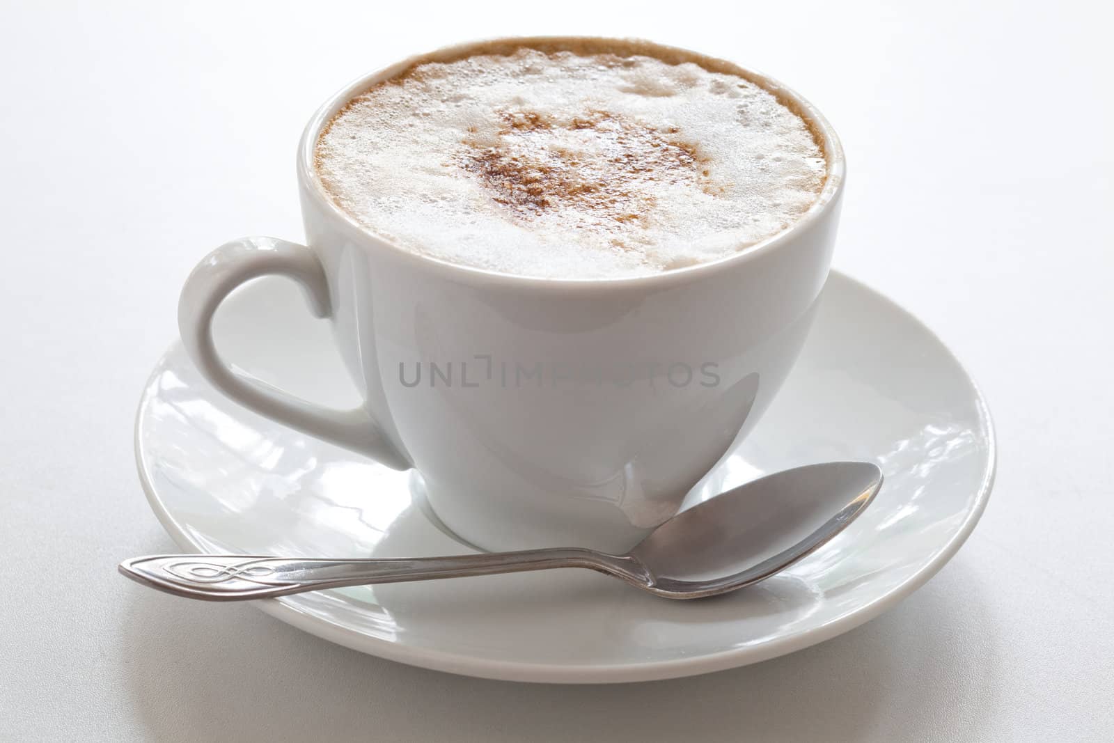 Cup of hot cappuccino, close-up