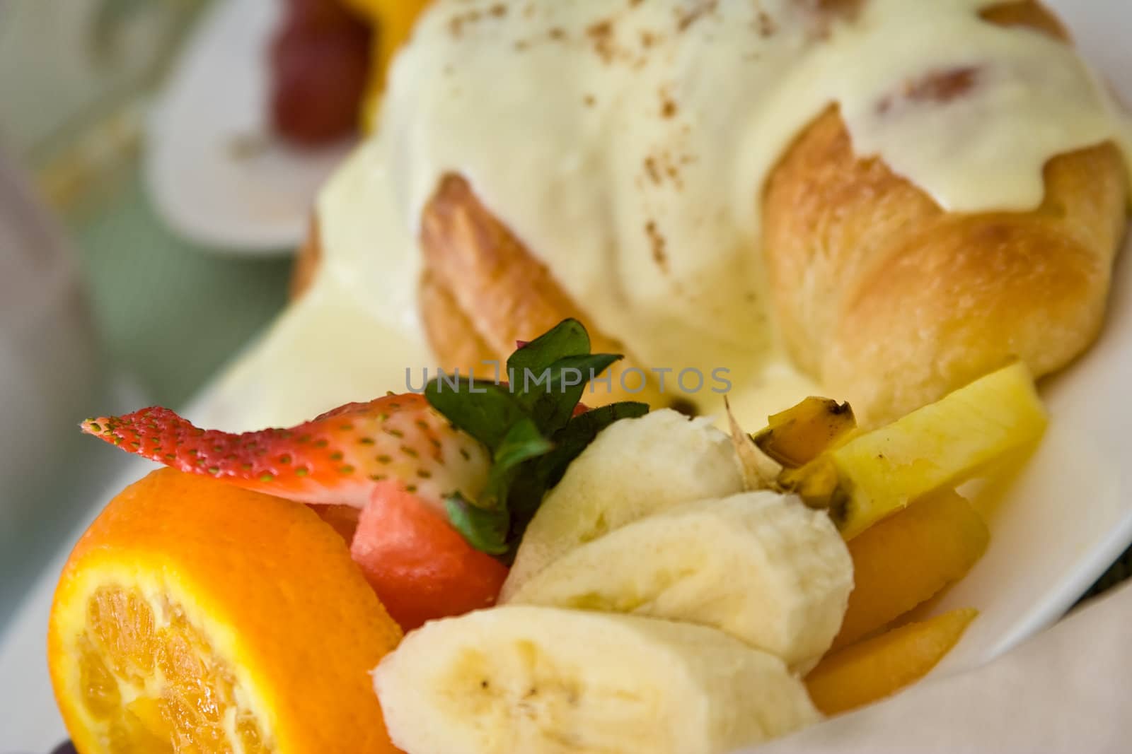 a light and healthy breakfast fresh fruit on white china