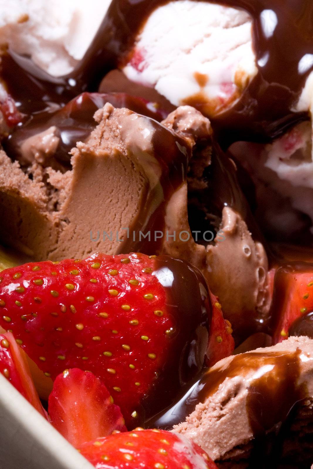 ice cream covered in chocolate shot close up dark background