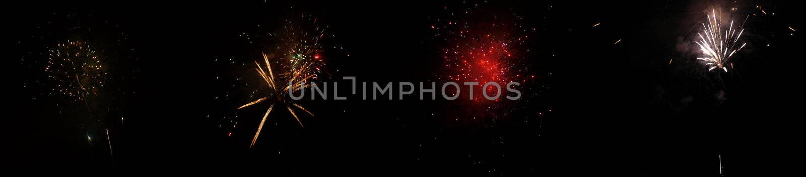 Fireworks display at night with dark black sky background