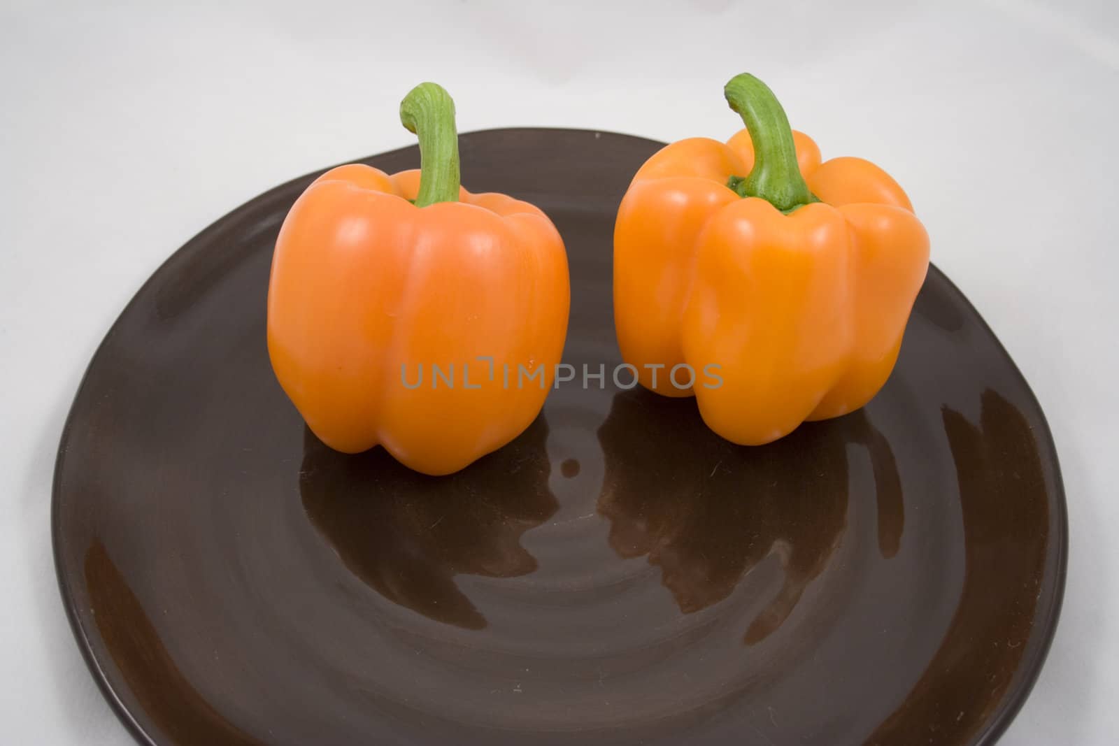 Orange peppers on a plate waiting for the salad
