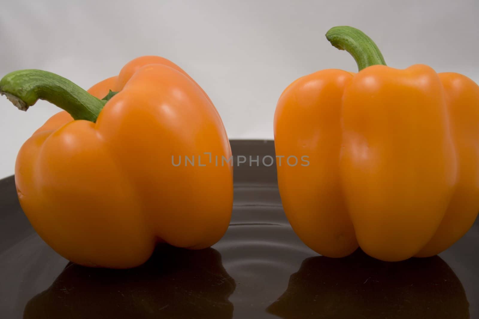 Orange peppers on a plate waiting for the salad
