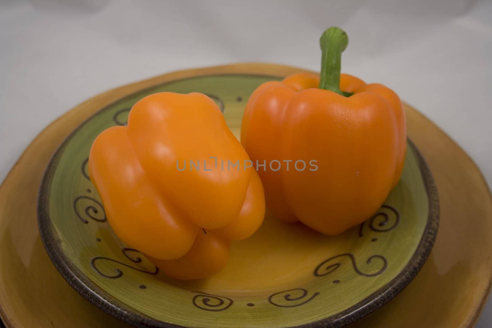 Orange peppers on a plate waiting for the salad
