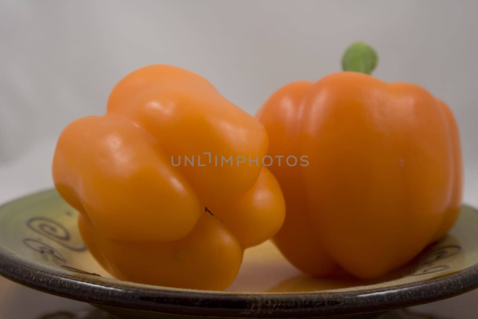 Orange peppers on a plate waiting for the salad
