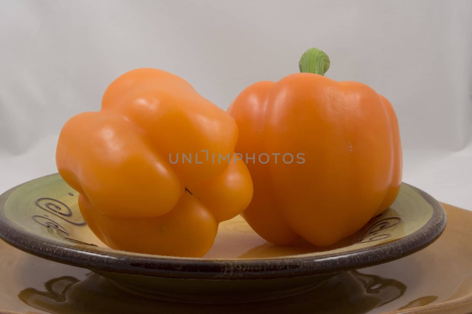 Orange peppers on a plate waiting for the salad
