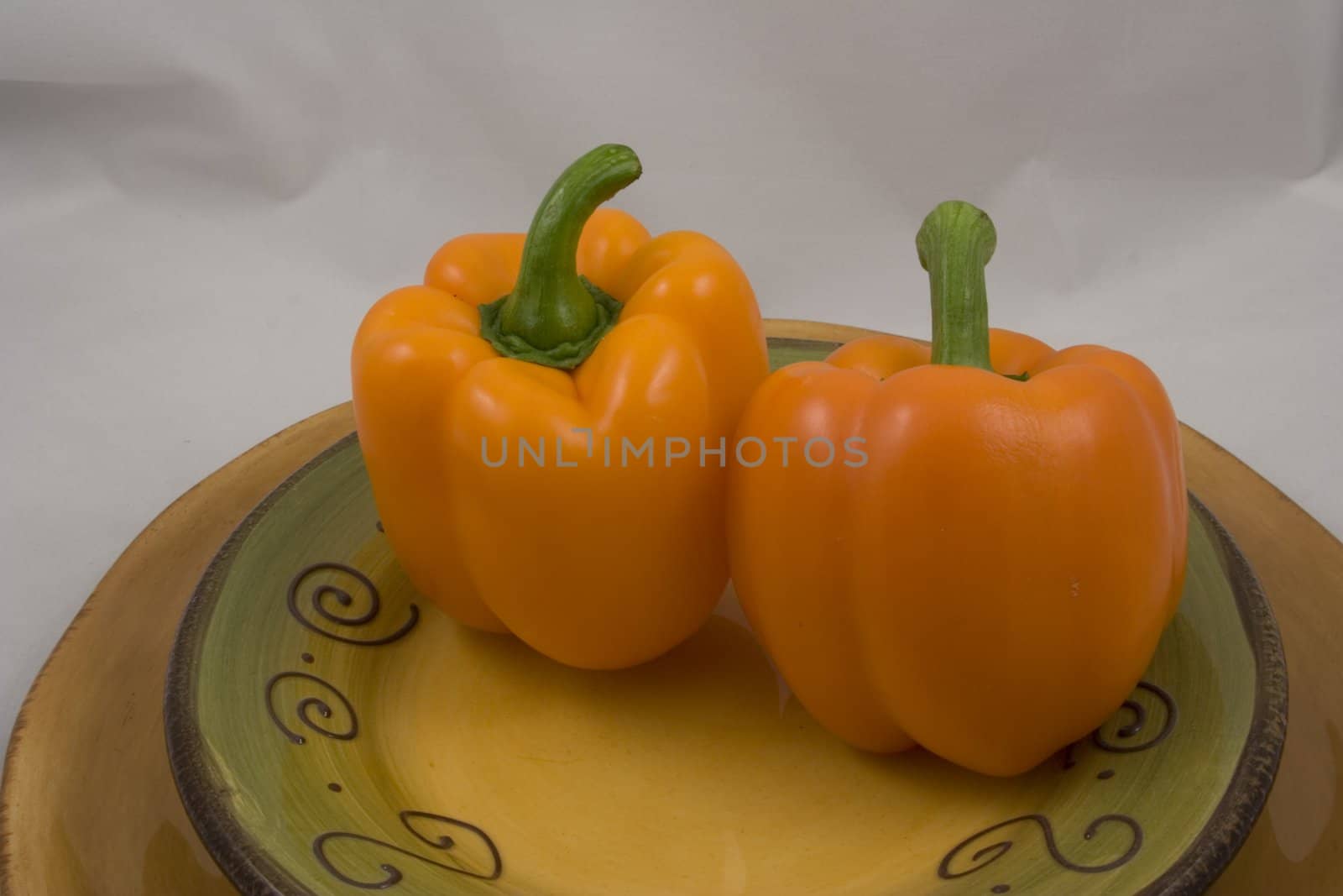 Orange peppers on a plate waiting for the salad
