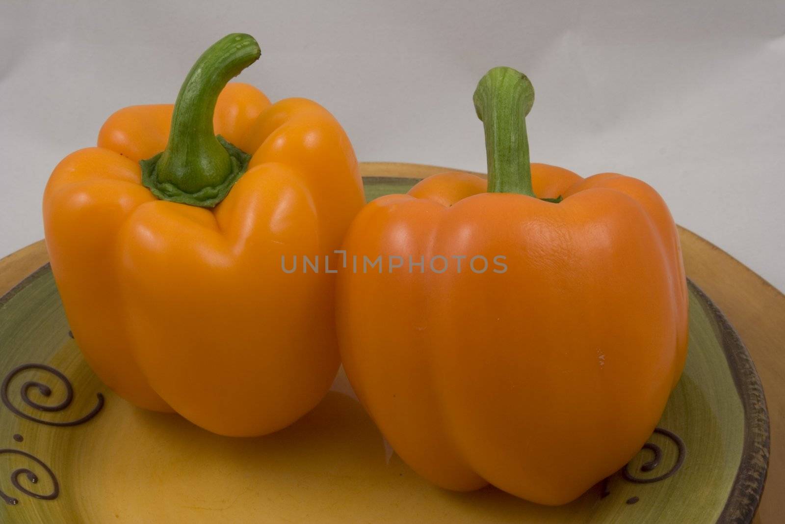 Orange peppers on a plate waiting for the salad
