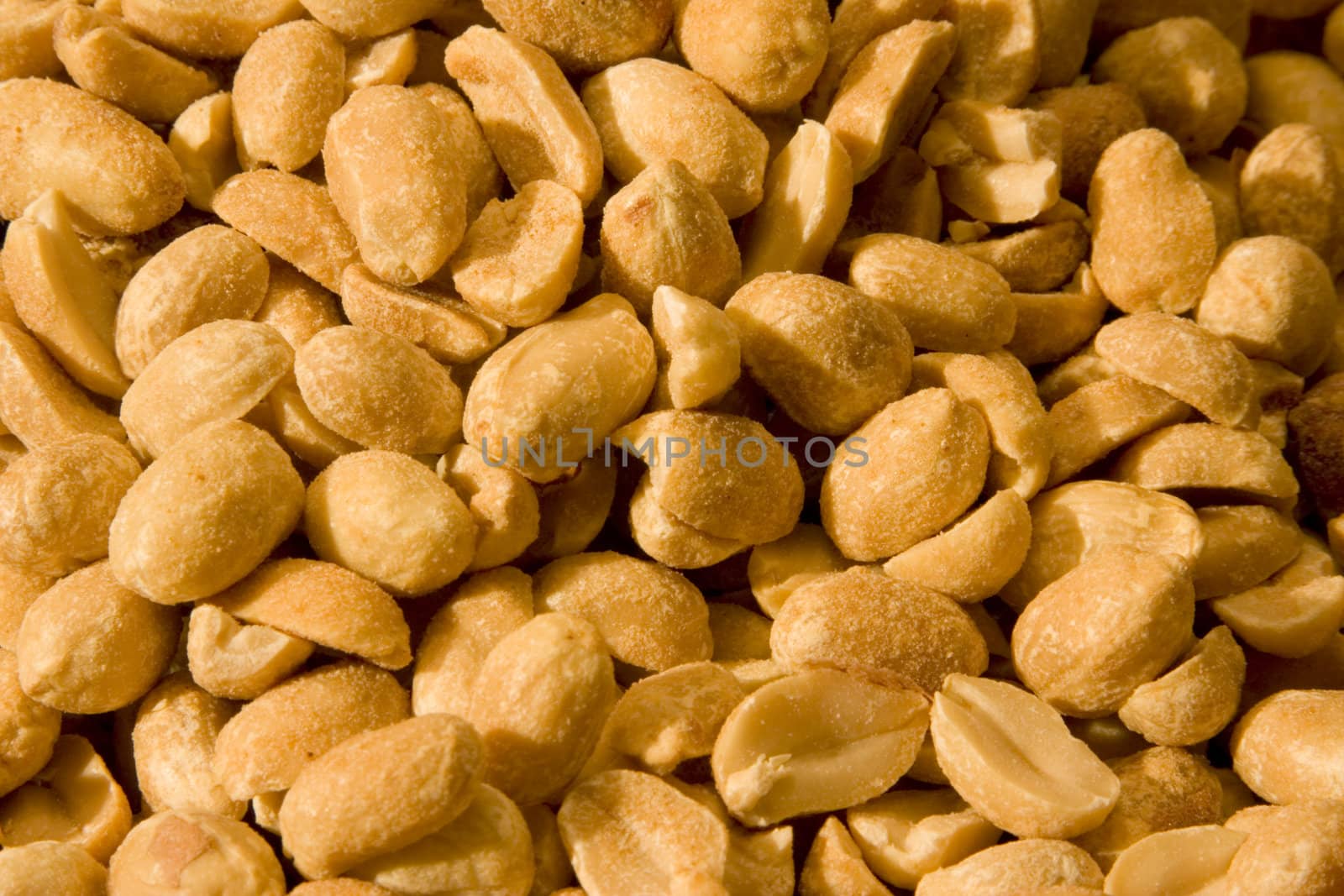 Dry Roasted peanuts close up by snokid