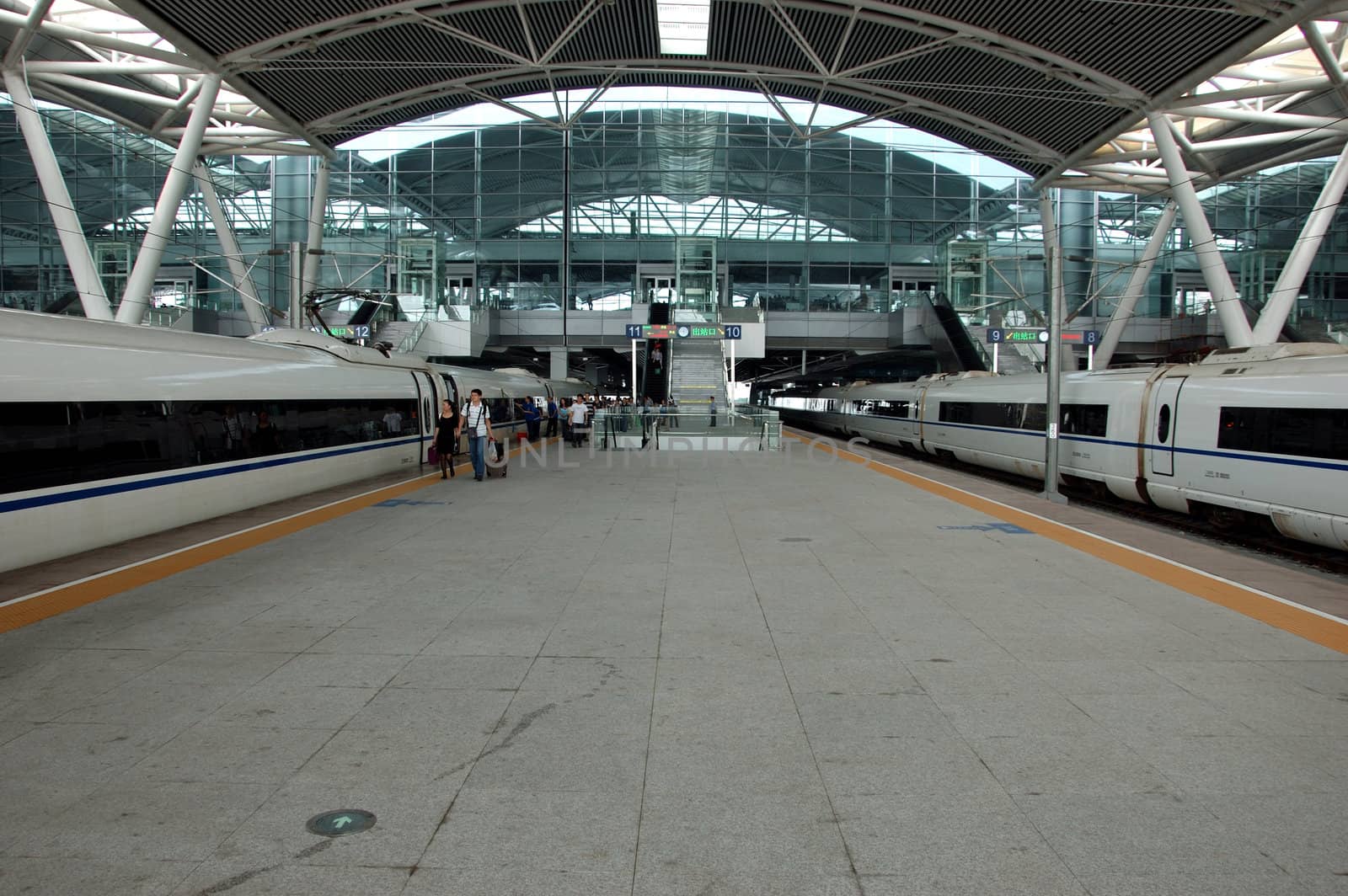 GUANGZHOU, CHINA - SEPTEMBER 29: China invests in fast and modern railway, trains with speed over 340 km/h. Trains to Wuhan on September 29, 2010 wait in newly build Guangzhou South station.