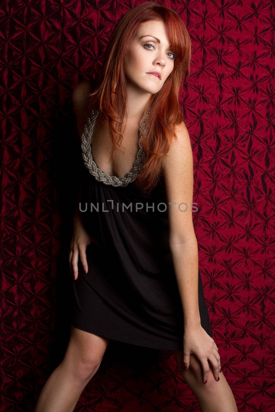 Sexy redhead fashion woman posing