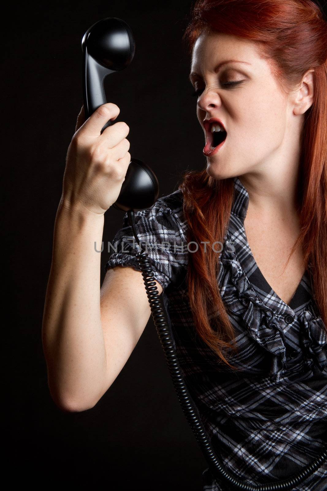 Beautiful angry redhead phone woman