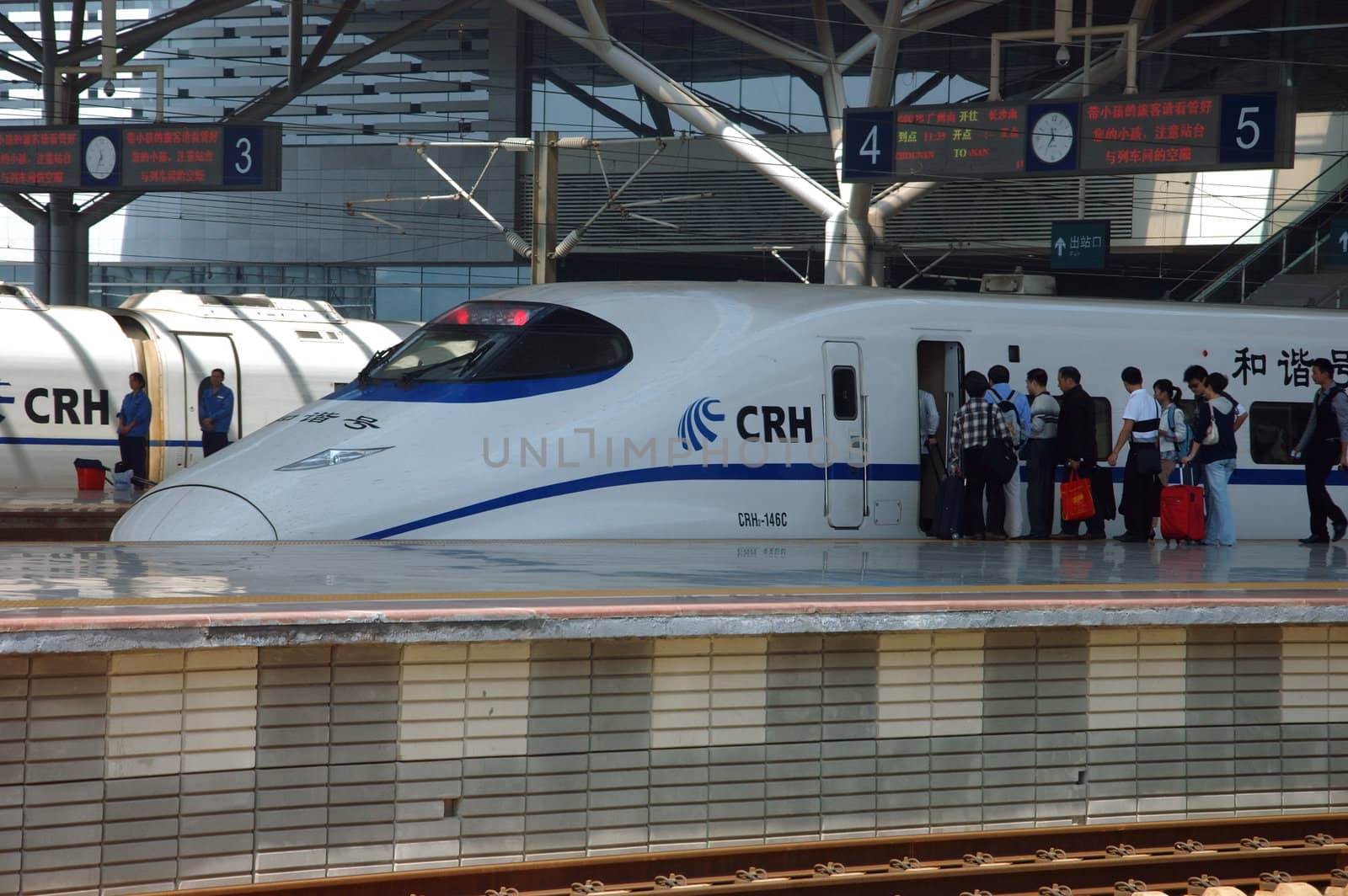 CHANGSHA - HUNAN, CHINA - OCTOBER 3: China invests in fast and modern railway, trains with speed over 340 km/h. Newly build station with trains on platforms on October 3, 2010 in Changsha.