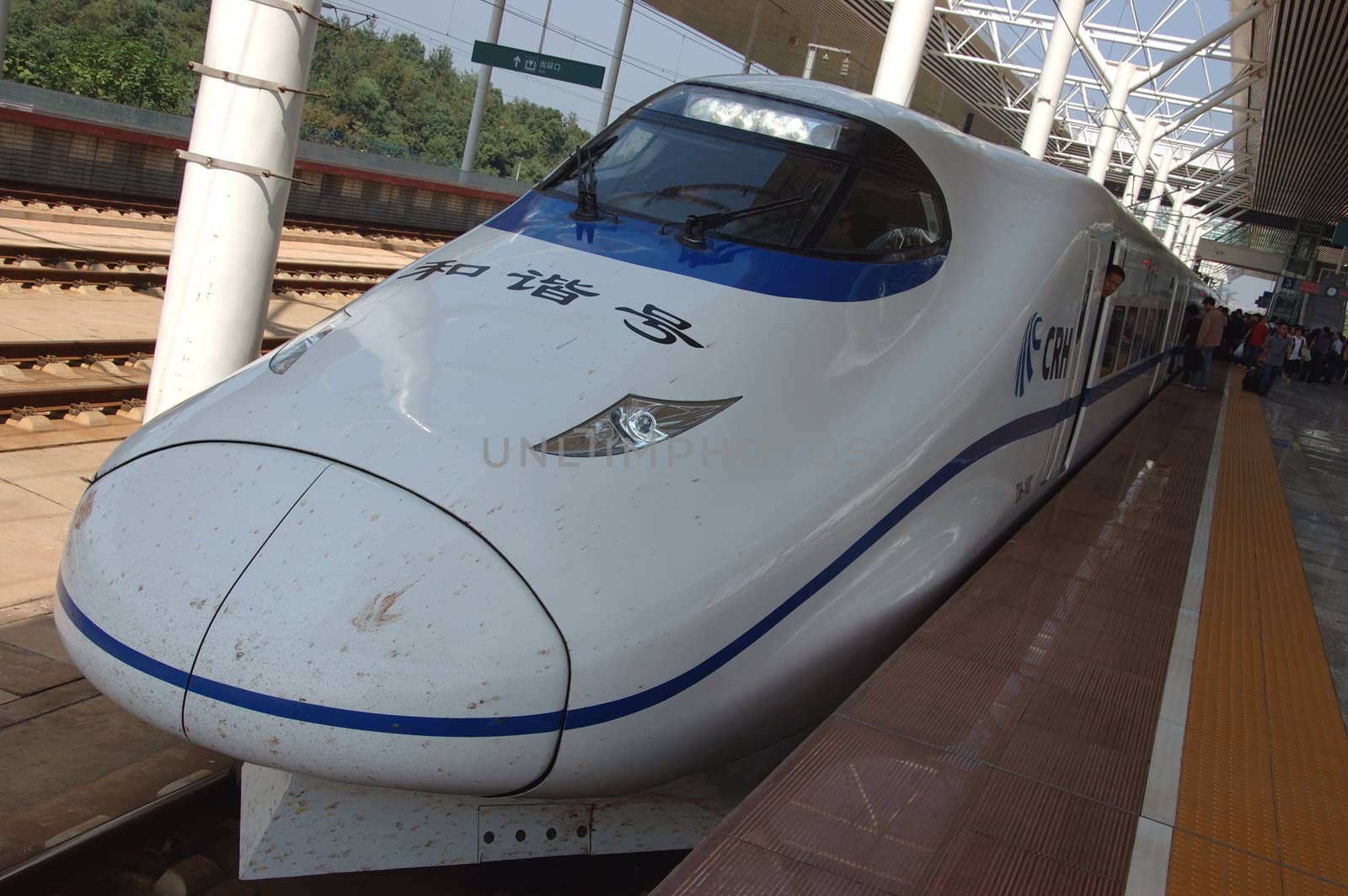 ZHUZHOU - HUNAN, CHINA - OCTOBER 3: China invests in fast and modern railway, trains with speed over 340 km/h. Modern train waits at platform on October 3, 2010 in ZhuZhou station.