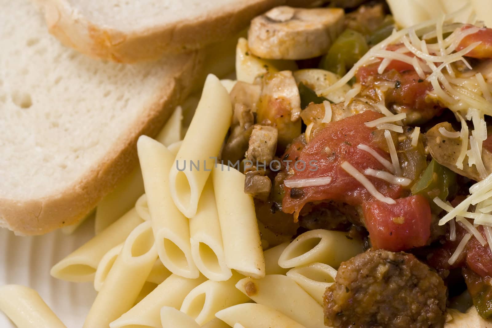 serving of penne spaghetti white dishes nice reddish colors