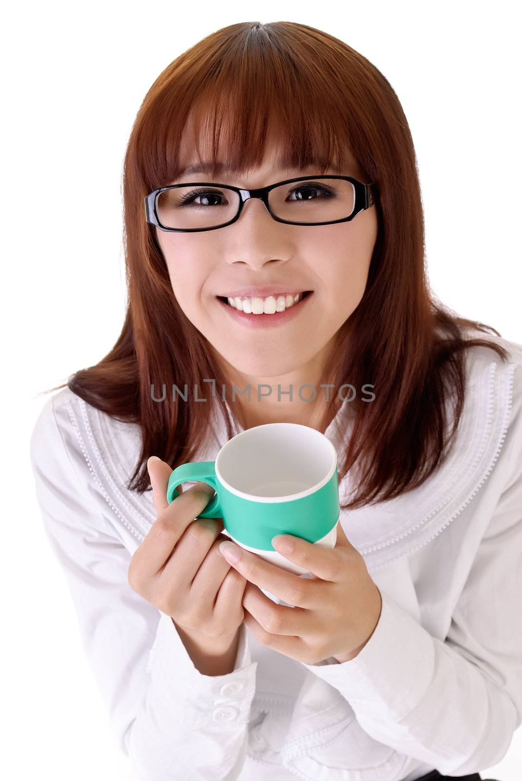 Happy business woman holding cup of coffee with smiling expression against white background.